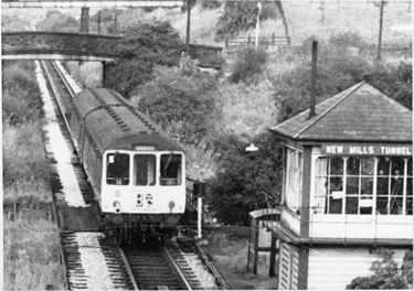 Hayfield railway line, New Mills, with diesel train. Signal Box - New Mills Tunnel End - and St George's Road bridge. View towards Hayfield. 	